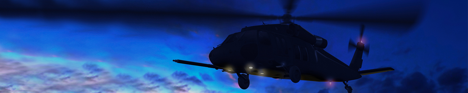 CH-60 helicopter flying at sunset