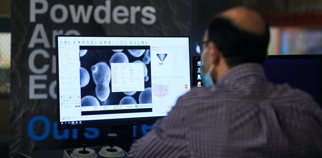 An Equispheres materials scientist examines a sample of tailor-made, high-performance additive manufacturing feedstock.