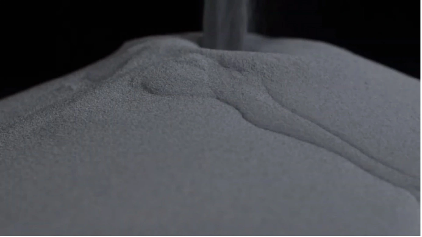 A close-up view of a pile of powder, showcasing its fine texture and natural grains.